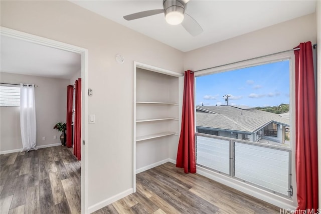 interior space featuring hardwood / wood-style floors and ceiling fan