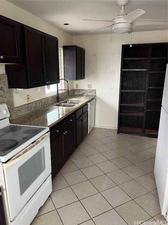 kitchen with sink, light tile patterned floors, ceiling fan, dark brown cabinets, and white appliances