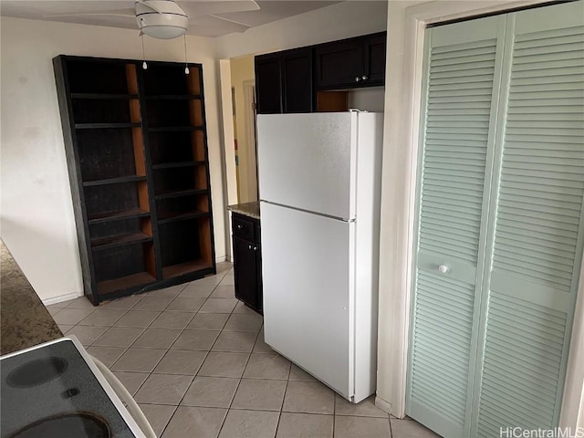 kitchen with white refrigerator and light tile patterned floors