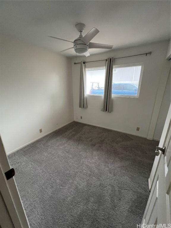 carpeted empty room with ceiling fan