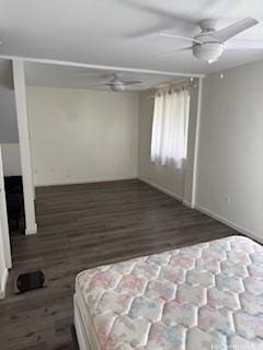 unfurnished bedroom featuring dark hardwood / wood-style floors and ceiling fan