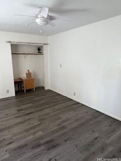 unfurnished bedroom featuring dark wood-type flooring and ceiling fan