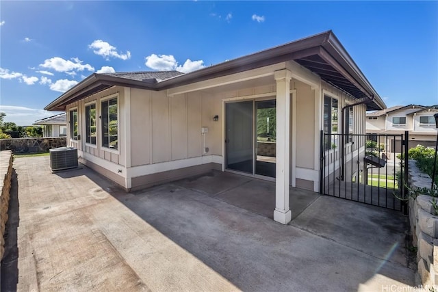 back of house with a patio area and central AC unit