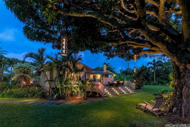 yard at dusk with a deck