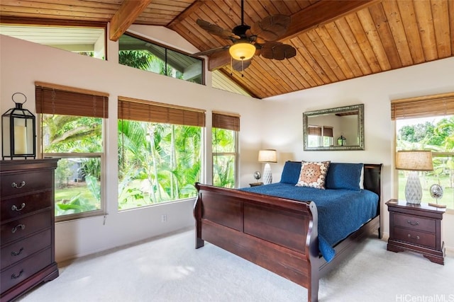 bedroom with ceiling fan, light colored carpet, wood ceiling, and vaulted ceiling with beams