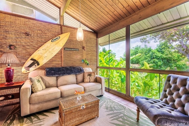 sunroom with a wealth of natural light and lofted ceiling with beams