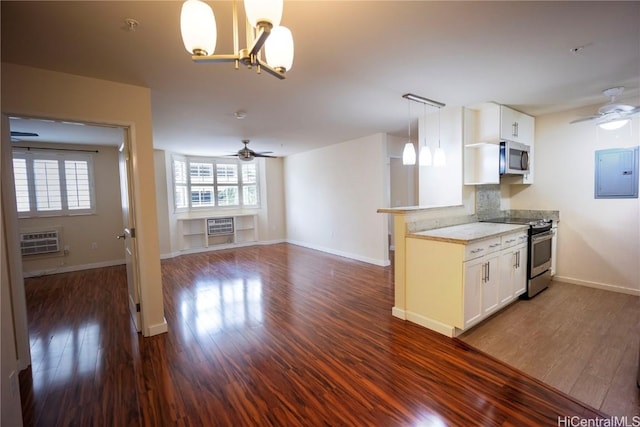 kitchen with backsplash, electric panel, white cabinetry, and stainless steel appliances