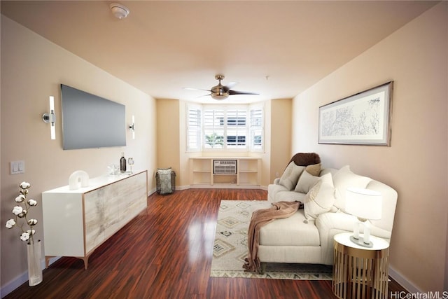 living room featuring ceiling fan and dark hardwood / wood-style floors