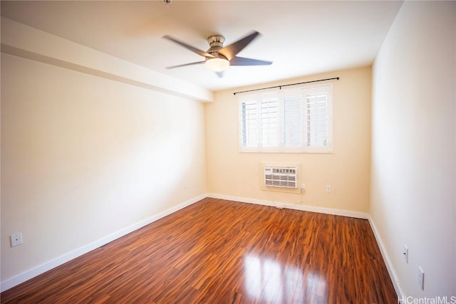 spare room with heating unit, ceiling fan, and hardwood / wood-style floors