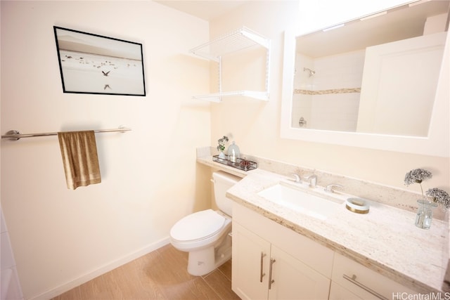 bathroom featuring hardwood / wood-style floors, vanity, and toilet