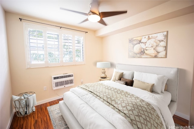 bedroom featuring a wall mounted AC, dark hardwood / wood-style flooring, heating unit, and ceiling fan