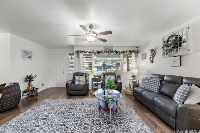 living room with wood-type flooring and ceiling fan