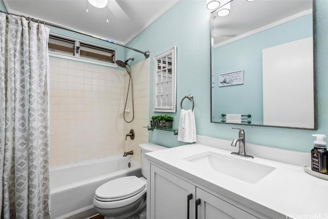 full bathroom with vanity, shower / bath combination with curtain, toilet, and ceiling fan