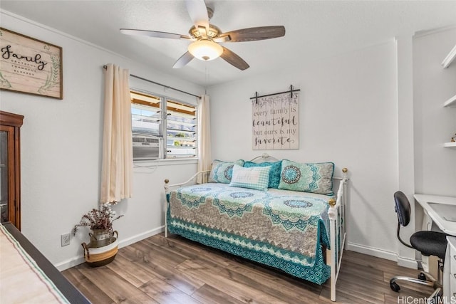 bedroom featuring ceiling fan and dark wood-type flooring