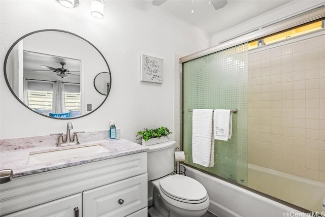 full bathroom featuring ceiling fan, vanity, enclosed tub / shower combo, and toilet