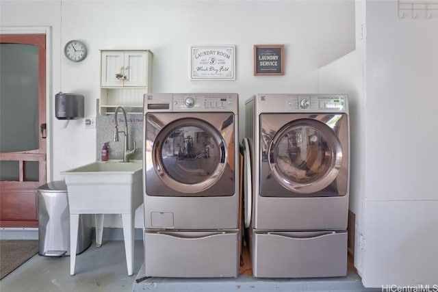 clothes washing area with separate washer and dryer