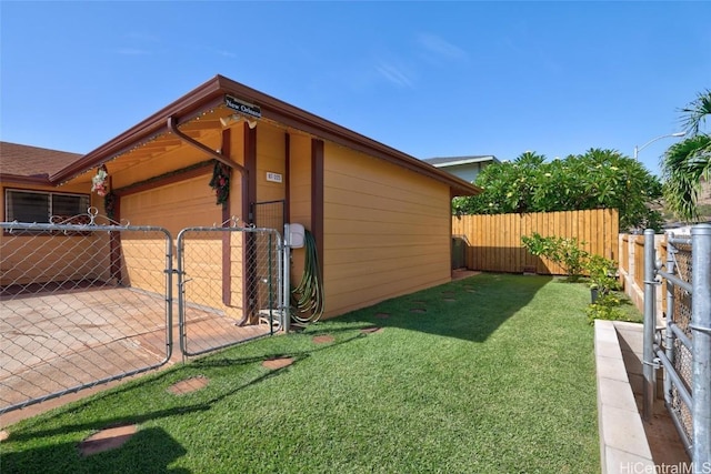 view of property exterior featuring a yard and a garage