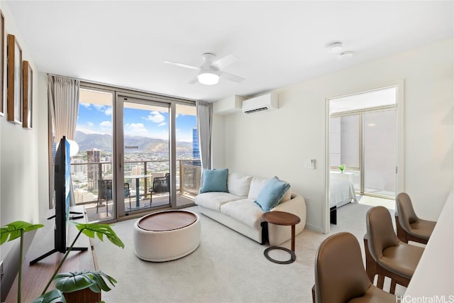 carpeted living room with ceiling fan, a wall of windows, and an AC wall unit