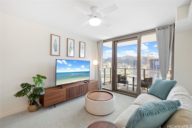 living room with light carpet and ceiling fan