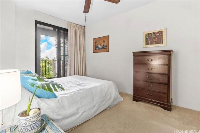 bedroom with ceiling fan and light colored carpet