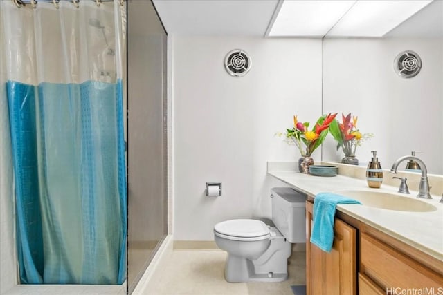 bathroom featuring toilet, vanity, a skylight, and curtained shower