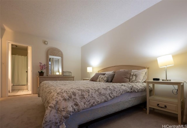 bedroom with carpet flooring, lofted ceiling, and a textured ceiling