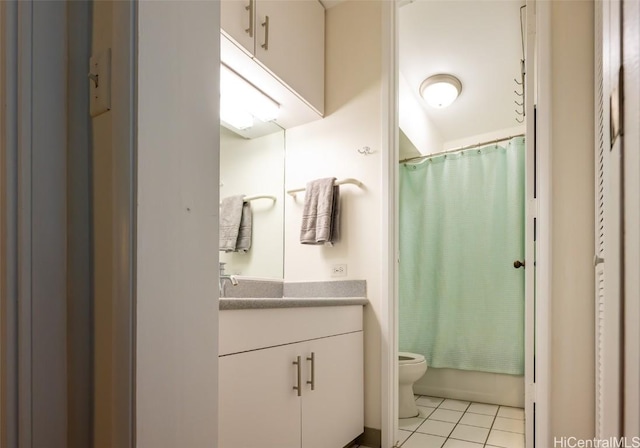 full bathroom featuring tile patterned flooring, vanity, toilet, and shower / tub combo