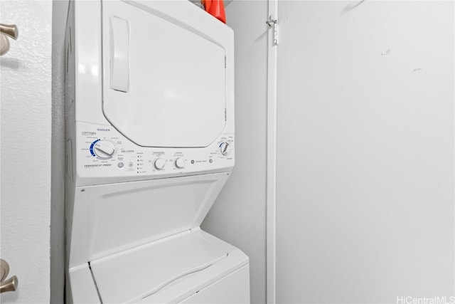 laundry room featuring stacked washer and clothes dryer