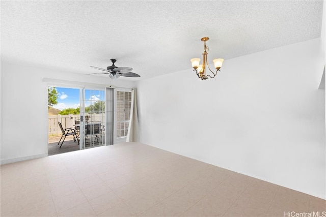 unfurnished room with a textured ceiling and ceiling fan with notable chandelier