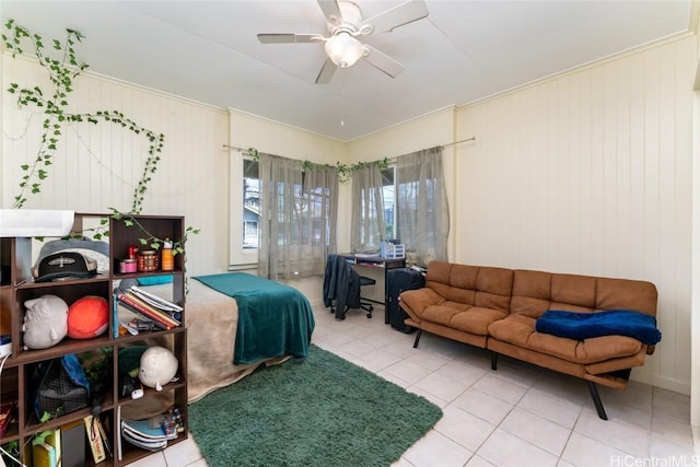 bedroom with tile patterned flooring, ceiling fan, and wooden walls