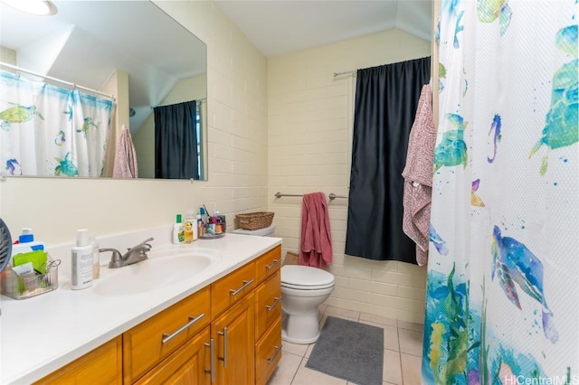 bathroom featuring a shower with curtain, vanity, tile walls, tile patterned flooring, and toilet