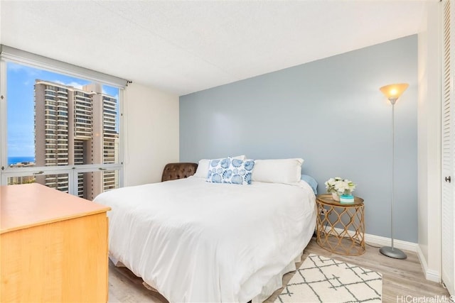 bedroom featuring hardwood / wood-style flooring and a closet