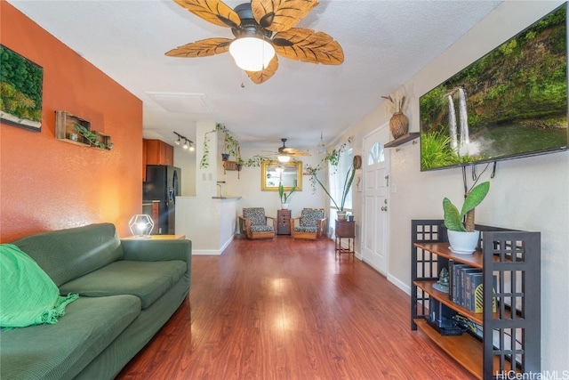 living room featuring hardwood / wood-style floors and a textured ceiling