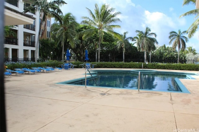 view of swimming pool featuring a patio area