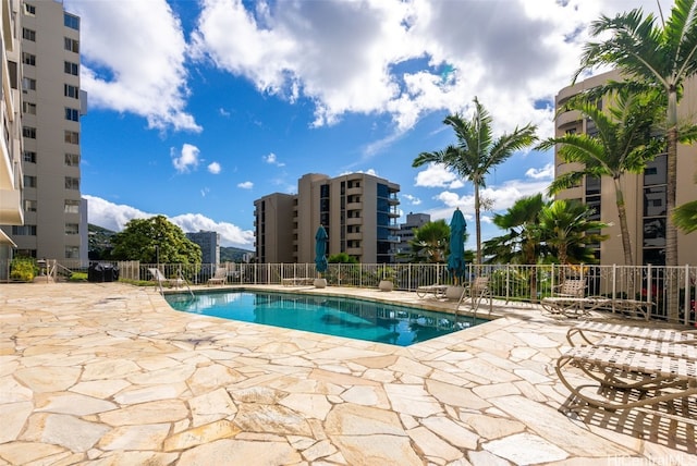 view of swimming pool with a patio area