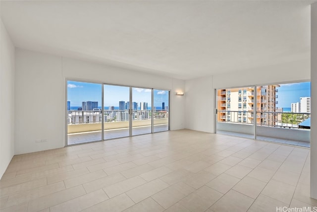 empty room with light tile patterned flooring