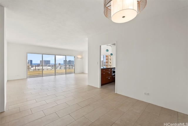 empty room featuring light tile patterned floors