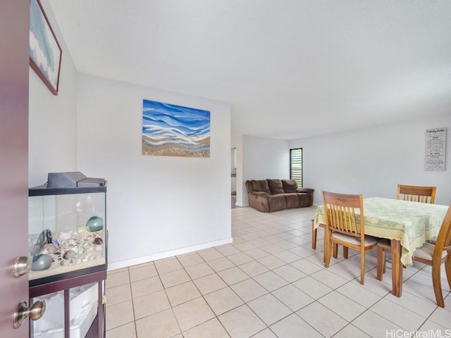 dining area featuring light tile patterned floors