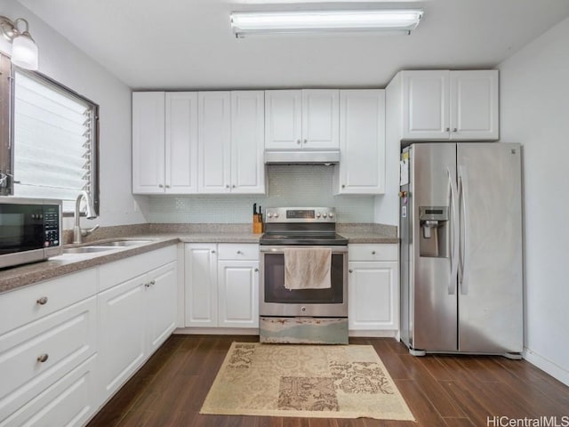 kitchen featuring appliances with stainless steel finishes, dark hardwood / wood-style flooring, tasteful backsplash, sink, and white cabinets