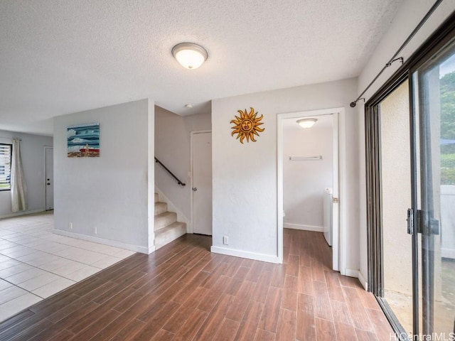 spare room with a textured ceiling