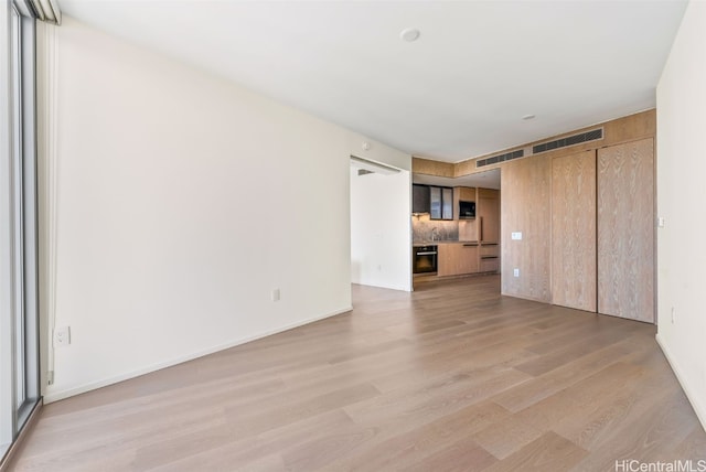 unfurnished living room with light hardwood / wood-style floors