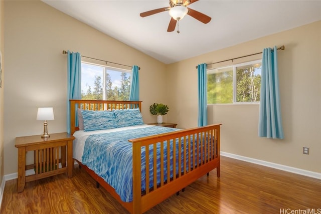 bedroom featuring ceiling fan, wood-type flooring, and lofted ceiling