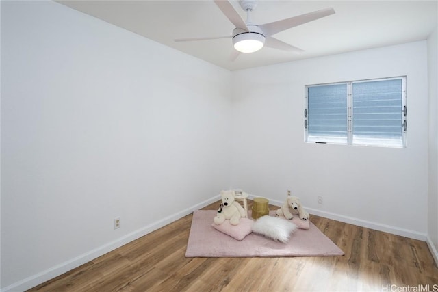 spare room with ceiling fan and wood-type flooring