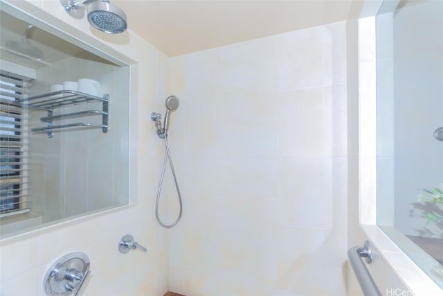 bathroom with tiled shower