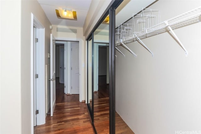 corridor with dark wood-type flooring