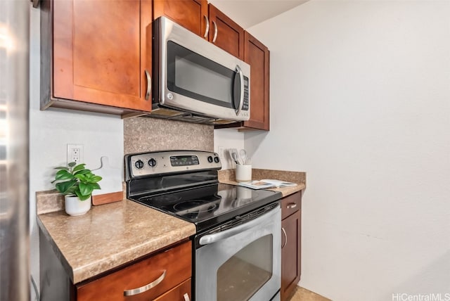 kitchen featuring backsplash and appliances with stainless steel finishes