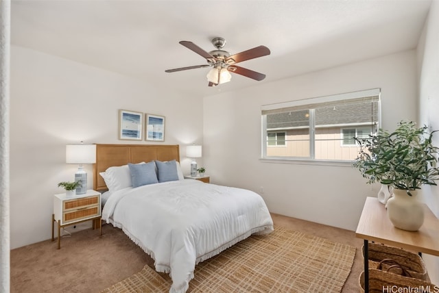 bedroom with ceiling fan and light colored carpet