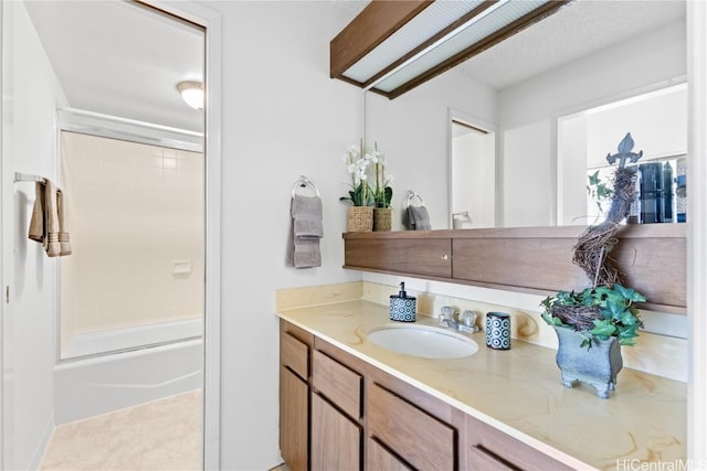 bathroom featuring bathtub / shower combination and vanity