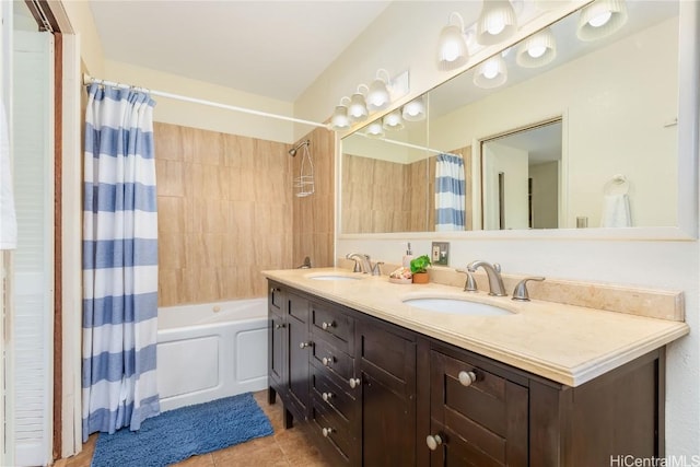 bathroom with tile patterned flooring, vanity, and shower / bath combo