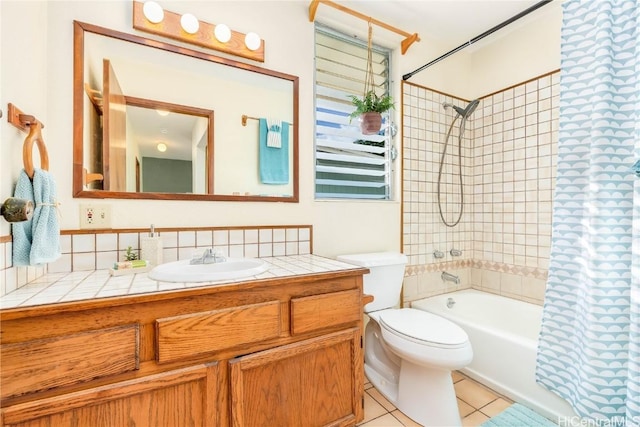 full bathroom with tile patterned flooring, shower / bath combo, toilet, and vanity